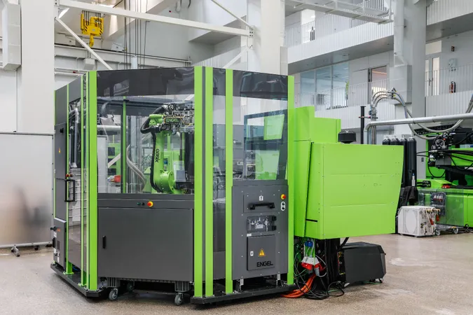 Injection moulding cell with ENGEL victory machine and easix six-axis robot for the fully automated production of thermoplastic composite rotor blades, rear view